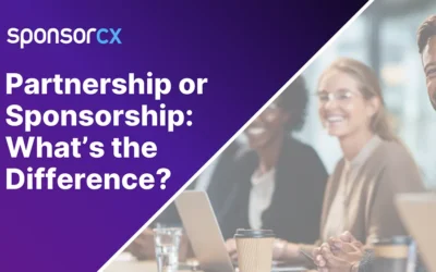 Cross-functional brand and partner teams collaborating around a table in a modern workspace, reviewing documents and tablets in a focused, professional discussion.